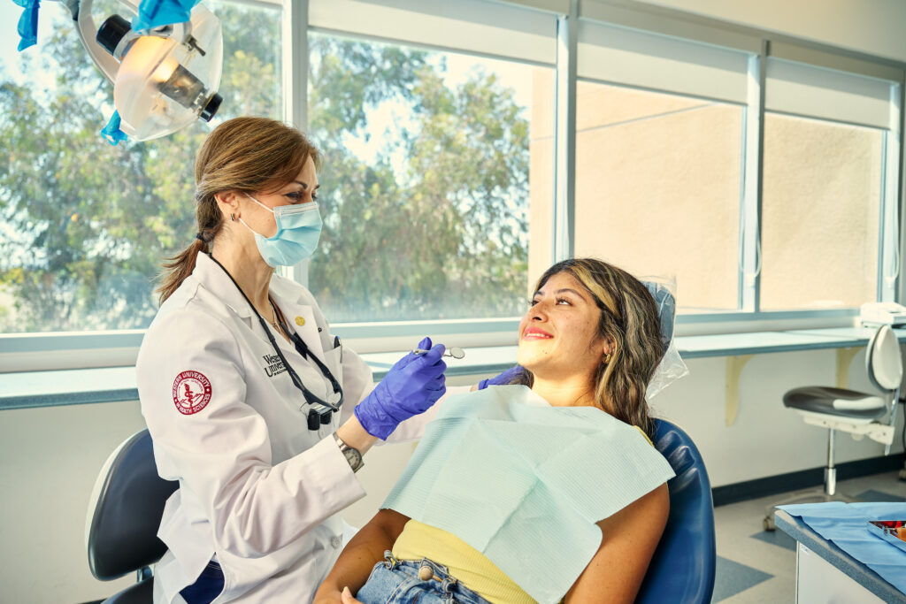 A female patient talking to a female dentist in the dental center